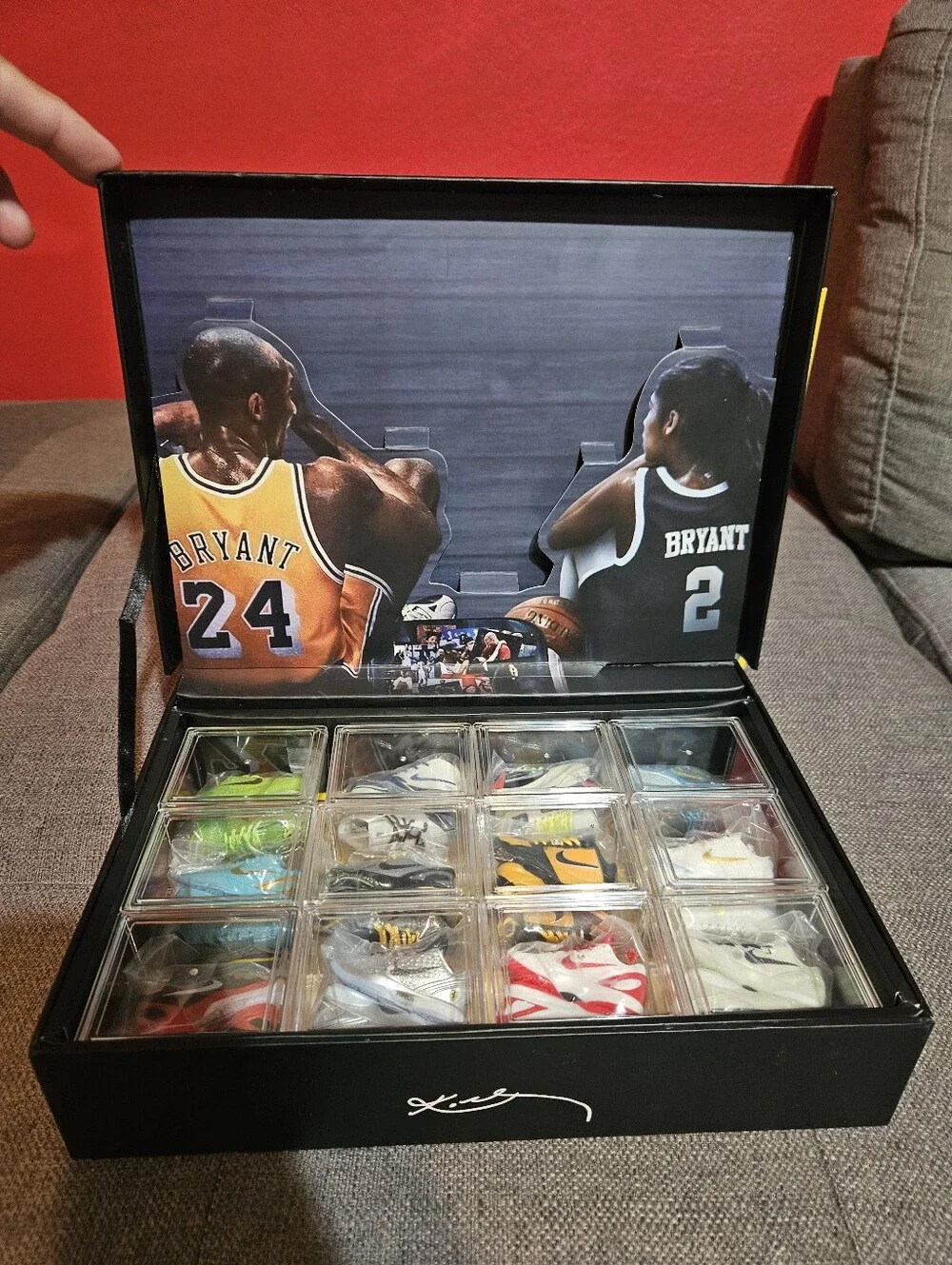 Kobe Black Mamba storage case with 12 mini sneakers included.